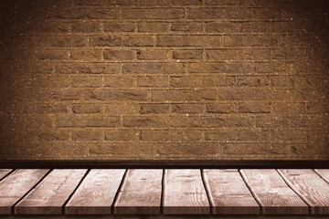 Wooden table in front of brick wall