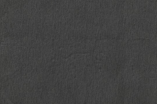 Fototapeta Dark gray textured surface is filling frame in flat design while showing fabric weave, copy space