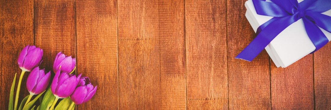 Fototapeta Flowers on wood floor with gifts