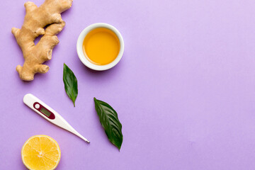 Natural cold and flu home remedies and thermometer. Natural ingredients for immunity stimulation and viruses protection. top view flat lay