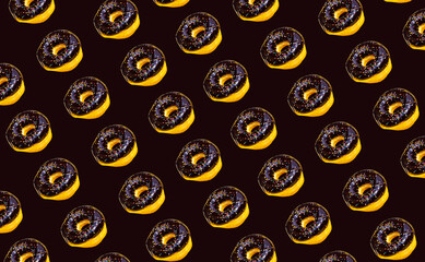 Donut with colorful toppings on dark background.Eating and unhealthy