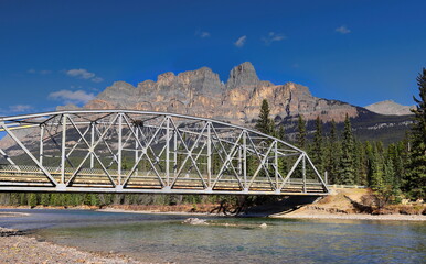 Metal, 9 panel, fixed bridge from 1950 on the Windermere Highway spanning the emerald-green Bow...