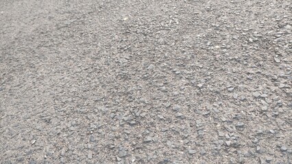a rough surface that comes from asphalt, as a rough and abstract texture background. photo without editing