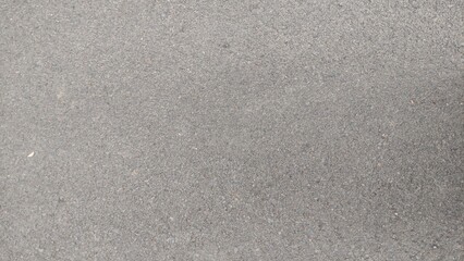 a rough surface that comes from asphalt, as a rough and abstract texture background. photo without editing
