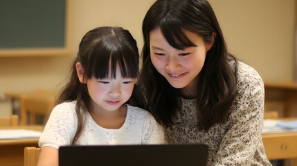 A parent guiding and supporting their child in educational tasks utilizing a laptop computer to enhance the learning experience in a warm and nurturing classroom environment