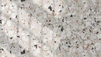 Close up of a speckled surface with white grey and black fragments scattered across the image plane