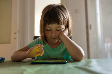 A child playing on her smart phone