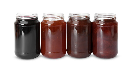 Different sweet jams in jars isolated on white