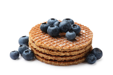 Tasty Dutch waffles (stroopwafels) and blueberries isolated on white