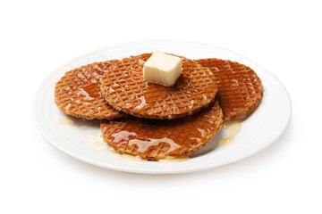 Tasty Dutch waffles (stroopwafels) with honey and butter cube isolated on white