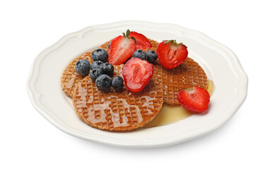 Tasty Dutch waffles (stroopwafels) with honey, strawberries and blueberries isolated on white