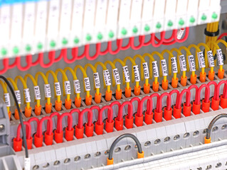 Marking electrical wiring wires with thermally printed nylon tape. 