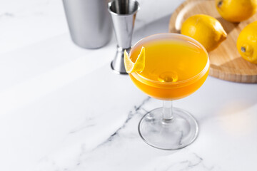 Paper plane cocktail on white marble background. Copy space