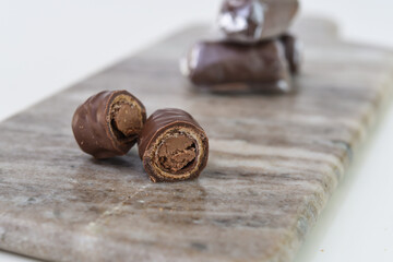 Chocolate Filled Wafer Rolls on Marble reveal a creamy chocolate filling within the crisp wafer...