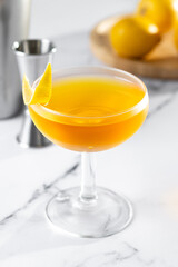 Paper plane cocktail on white marble background