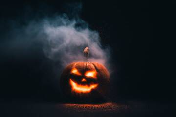 Spooky glowing jack-o’-lantern in dark smoky setting, eerie Halloween mood – perfect for horror, autumn, or festive concept