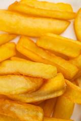 Crispy golden French fries piled high and freshly cooked, offering a warm and savory snack or side dish loved around the world