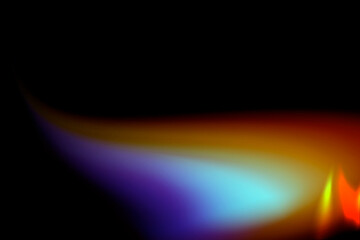 Colorful rainbow light flame glowing in dark background