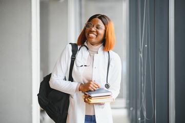 Female African-American student in hall of medical university