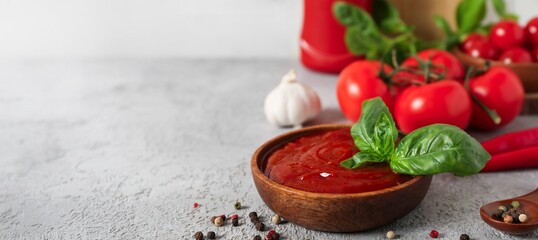 Bowl of tasty ketchup on table, closeup. Banner for design