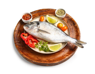 Plates with raw dorado fish and ingredients on white background
