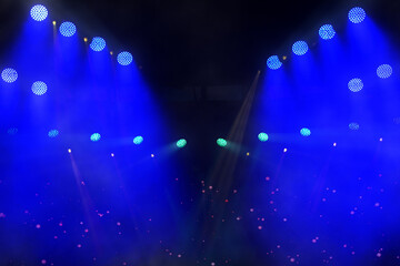 A light show with many lights in the air. The lights are blue and purple. The lights are in the air...