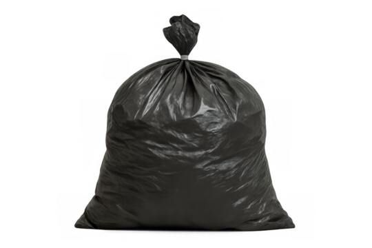 Black plastic trash bag lying crumpled against white backdrop, representing waste management and ecological impact