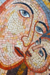 Mosaic artwork depicting abstract faces of Virgin Mary with Baby Jesus with vibrant colors found in a cultural center