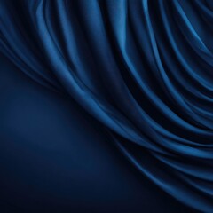 Obraz premium Deep blue silk fabric dramatically draped, creating soft, flowing curves and folds against a darker backdrop