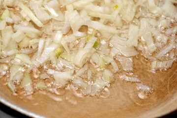 Sizzling onions create an aromatic base in a warm kitchen