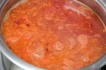 Delicious simmering stew bubbling in a pot on a cozy stove