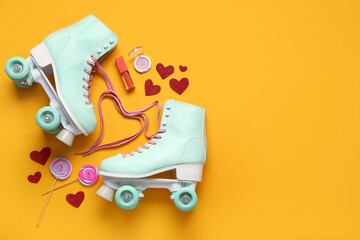Composition with pair of vintage roller skates and cosmetic products on orange background