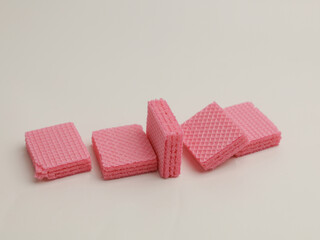 Pink strawberry wafer on white background