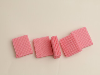 Pink strawberry wafer on white background
