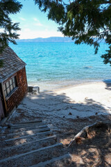 Sugar Pine Point Beach on Lake Tahoe with its beach, pine trees, and beautiful clear water.