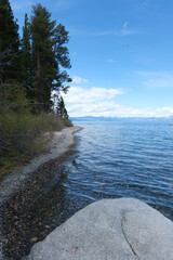 Sugar Pine Point Beach on Lake Tahoe with its beach, pine trees, and beautiful clear water.