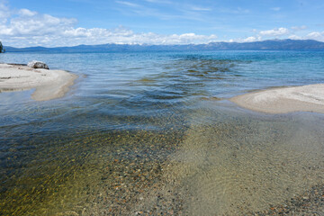 Sugar Pine Point Beach on Lake Tahoe with its beach, pine trees, and beautiful clear water.