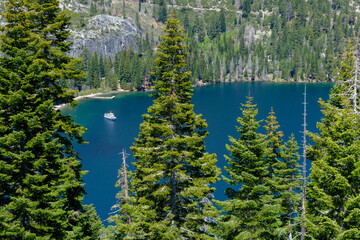 A view over the mountains and trees down to Emerald Bay on the Califoornia side of Lake Tahoe