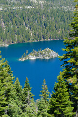 A view over the mountains and trees down to Emerald Bay on the Califoornia side of Lake Tahoe