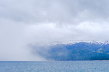Storm clouds and rain squalls blowing in across Lake Tahoe