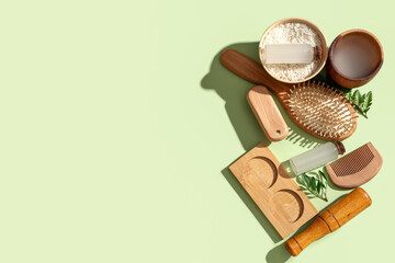 Composition with rice water, grains and bath supplies on green background