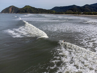 hundreds of surfers waiting for a perfect wave