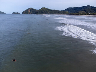 hundreds of surfers waiting for a perfect wave