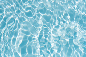 Blue water with ripples on the surface. Defocus blurred transparent blue colored clear calm water...