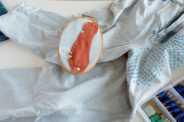 Visible Mending in Progress: Patchwork with Embroidery Hoop and Terracotta Fabric