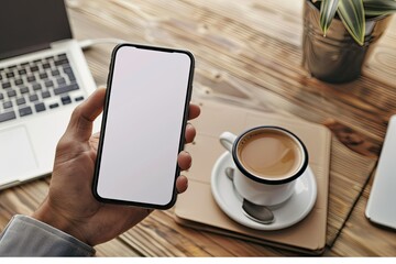 Premium Quality Picture of Man Holding Mockup Smartphone While Drinking Coffee in Workspace