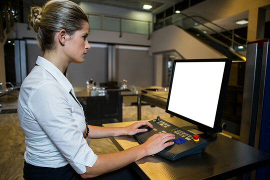 baggage scanner console sitting ready at security checkpoint, conveyor belt extending to right