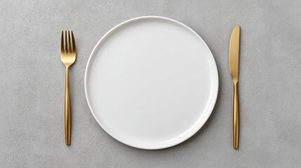Elegant Table Setting with Gold Fork and Knife on Simple Plate