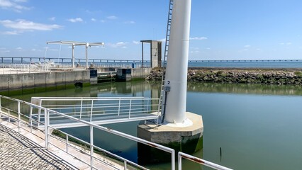Industrial waterway tranquility meets nautical modernism, evoking World Water Day and coastal engineering marvels May 23 2025, Lisbon, Portugal