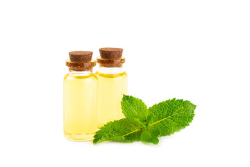 Essential oil mint isolated on white background. Peppermint essential oil with fresh mint leaves. A bottle of aromatherapy oil. Mint extract. The concept of natural cosmetics, spa care